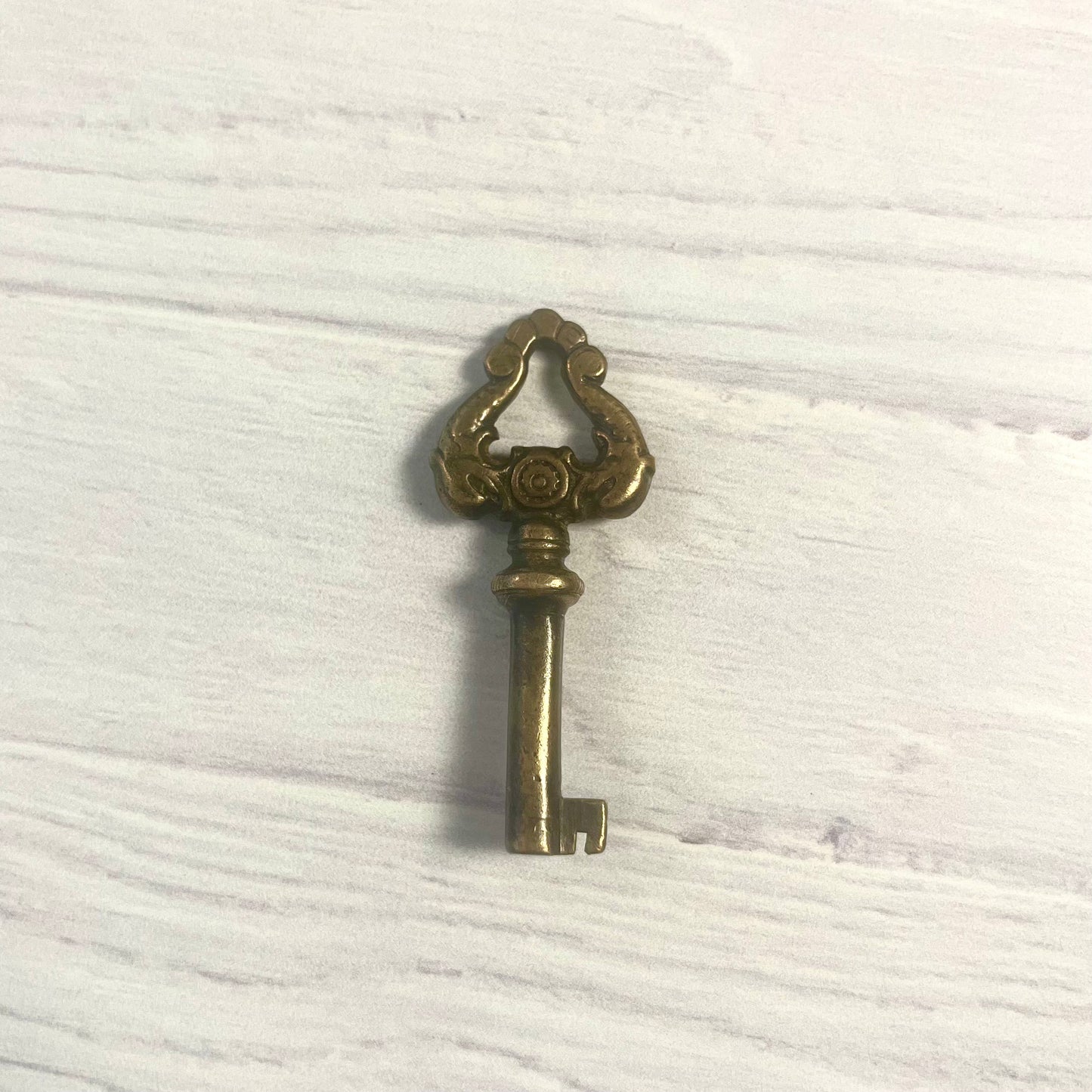Antique Brass Skeleton Key with Dolphin Motif