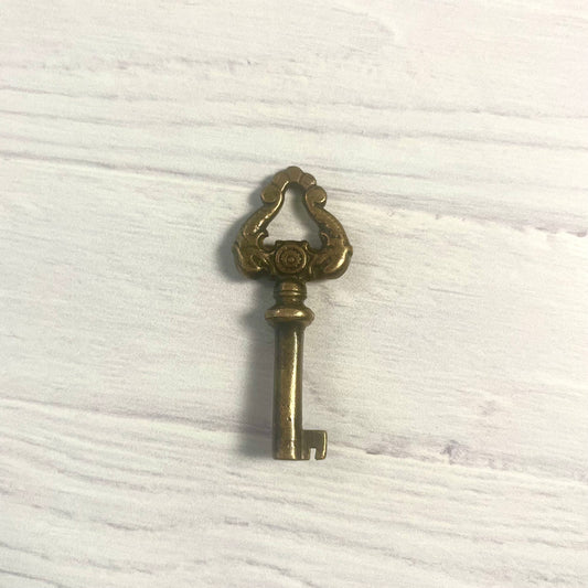 Antique Brass Skeleton Key with Dolphin Motif