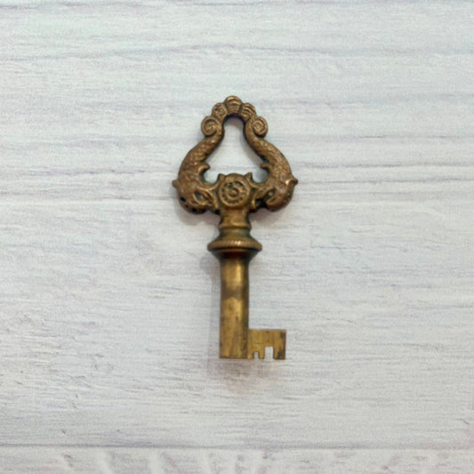 Antique Brass Skeleton Key with Dolphin Motif